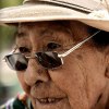 Old woman in Puno, Peru selling sweets