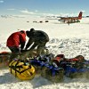 Loading luggage in a blizzard, Antarctica