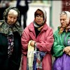 Babushkas waiting for coins