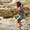 Global culture (2): little girl jumping puddles in Tibet