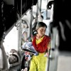 Girl selling stuff in a train, India