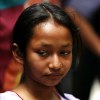 Nepali girl on street looking down