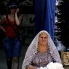Russian lady selling woolen scarves on the market