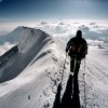 Climber descending on the summit ridge of Denali, Alaska USA