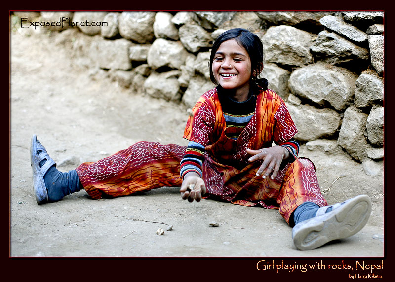 Girl playing with rocks, Phakding, Nepal