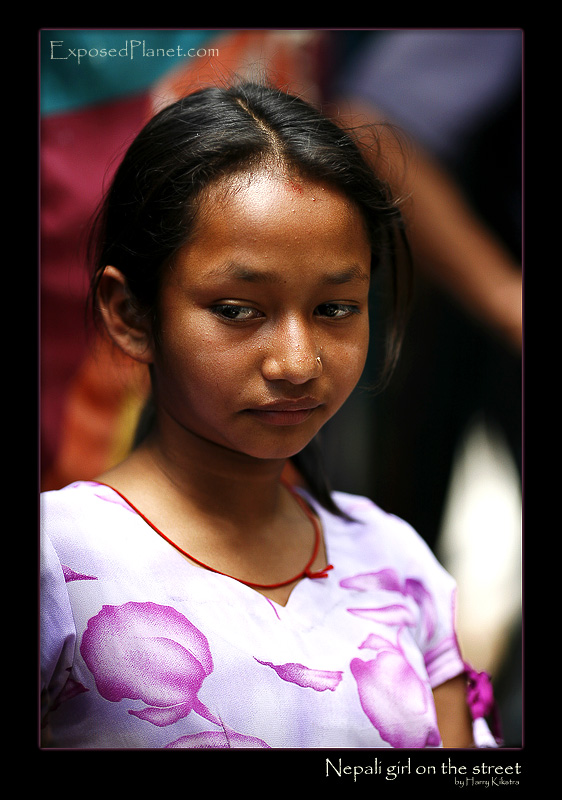 Nepali girl on street looking down
