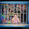 Photo of Shopkeeper behind bars in Guatemala on ExposedPlanet.com