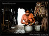 Young woman cleaning fish, Rio Napo, Peru
