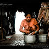Photo of Young woman cleaning fish, Rio Napo, Peru on ExposedPlanet.com