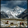 Photo of Porters on Baltoro Glacier with K2 in back on ExposedPlanet.com