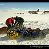 Loading luggage in a blizzard, Antarctica