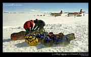 Loading luggage in a blizzard, Antarctica
