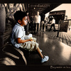 Boy waitin on a bus in Mendoza, Argentina
