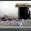 Photo of Butcher with yak meat in Nyalam, Tibet on ExposedPlanet.com