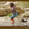 Photo of Global culture (2): little girl jumping puddles in Tibet on ExposedPlanet.com