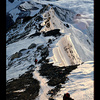 Between the steps: Climbers on summitridge of Everest