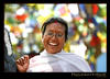 Happy Woman in Kathmandu with prayer flags
