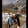 Photo of Construction in Nepal: men crushing rocks on ExposedPlanet.com