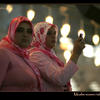 Photo of Muslim women taking photograps in Istanbuls Blue Mosque on ExposedPlanet.com