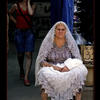 Photo of Russian lady selling woolen scarves on the market on ExposedPlanet.com
