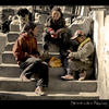 Photo of Street kids in Nyalam, Tibet emptying jam jars on ExposedPlanet.com