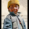 Photo of Tibetan boy with yellow hat on ExposedPlanet.com