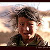 Photo of Tibetan girl with hair blowing on ExposedPlanet.com