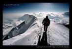 Climber descending on the summit ridge of Denali, Alaska USA