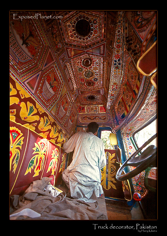 Man building and decorating trucks in Pakistan