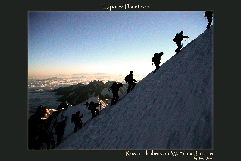 Row of climbers on Mt Blanc, France
