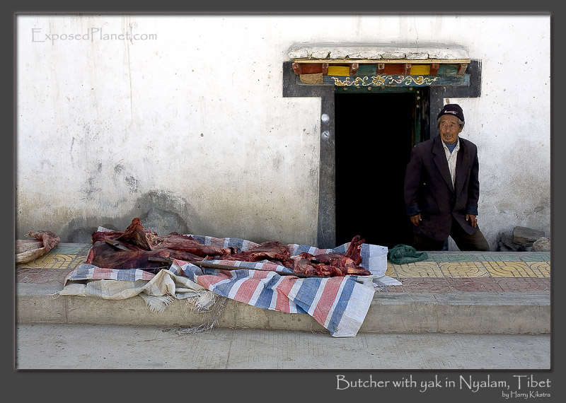 Butcher with yak meat in Nyalam, Tibet