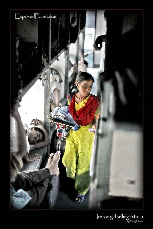 Girl selling stuff in a train, India