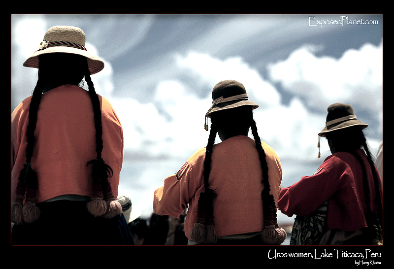 Three Uros women on lake Titicaca, Peru