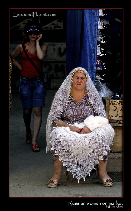 Russian lady selling woolen scarves on the market