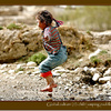 Global culture (2): little girl jumping puddles in Tibet