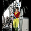 Girl selling stuff in a train, India