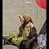 Russian lady selling vegetables on the market